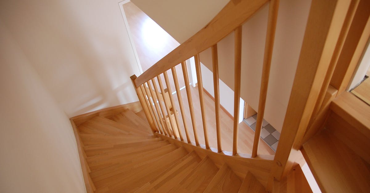 Wooden staircase with warm tones inside a minimalist home interior.